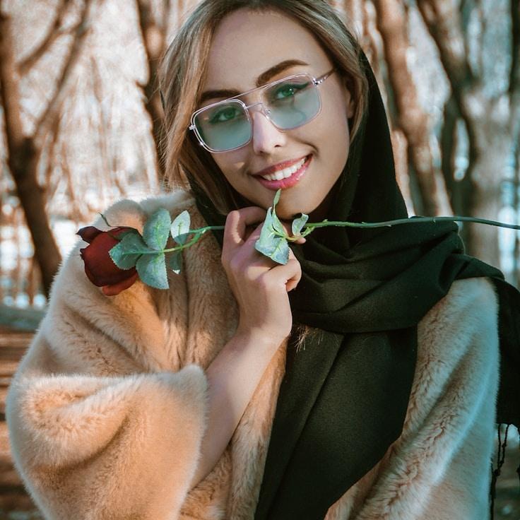 Avery Chen, Lead Design Curator at Marsh Quarry Lane, reviewing corporate floral arrangements